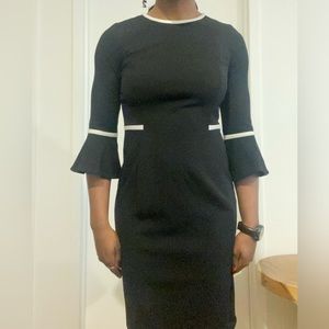 Calvin Klein size:4 black dress with flared sleeves.